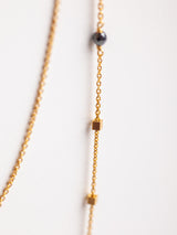 Leeloobird Favorite Necklace iwith a Gold chain necklace with small beads on a white background