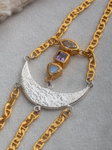 Meaningful Gold Vermeil and sterling silver Energy bracelet handmade by Leeloobird Jewlery baliwith a moon design on a light gray surface