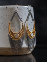 Model Wish earrings by leeloobird Bali featuring gold vermeil and sterling silver with mother pearl accents